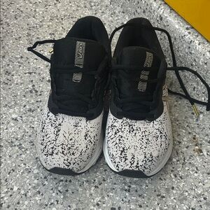 Asics Black and White with gold accents women's running Sneaker